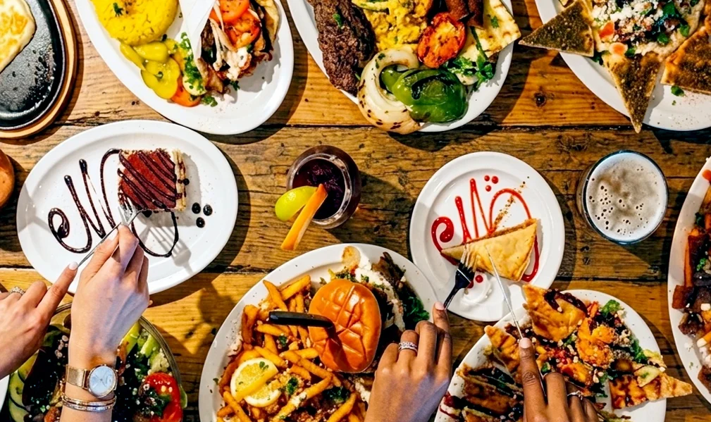 Assorted Mediterranean dishes with grilled meats and fresh sides