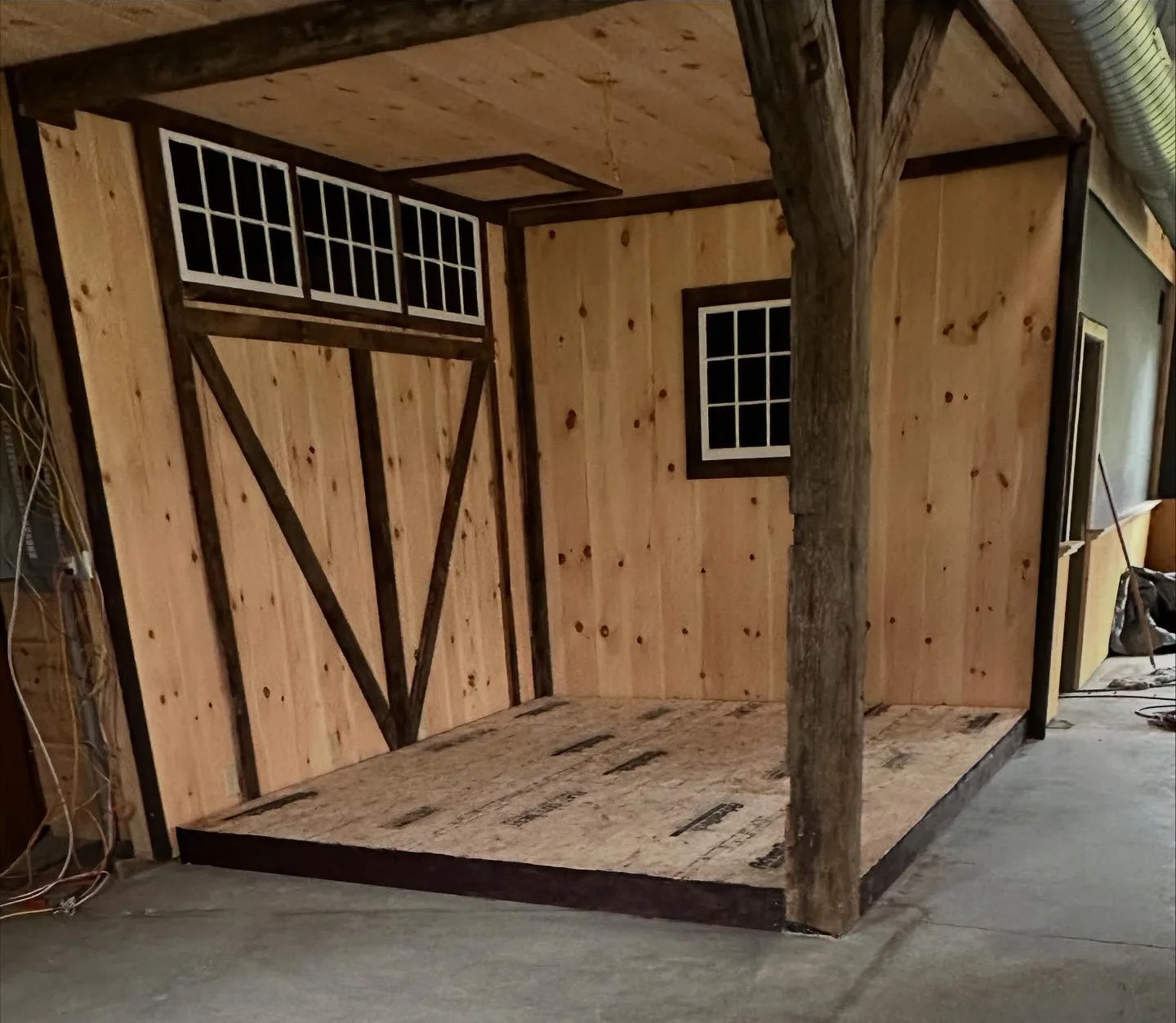 Interior of a rustic wooden structure with exposed beams