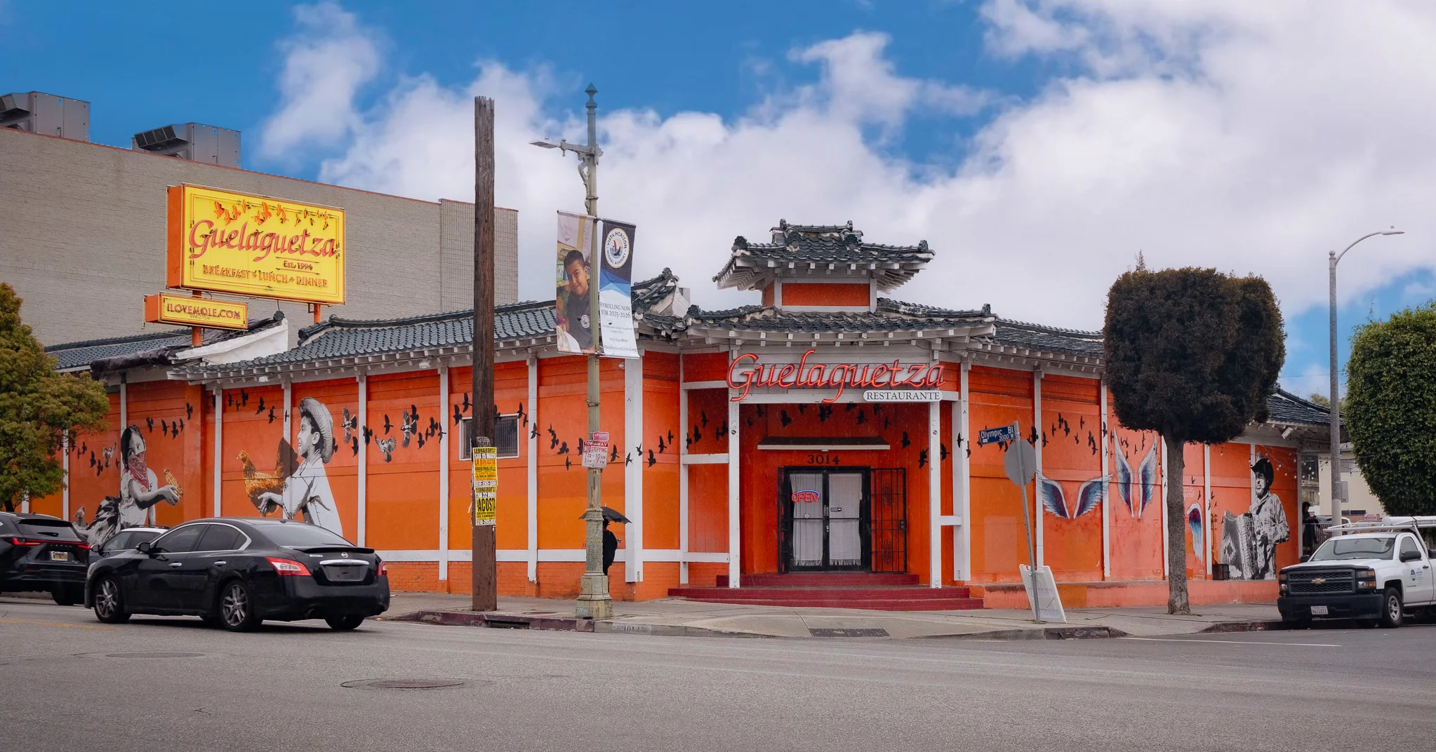 Colorful exterior of Guelaguetza restaurant with murals