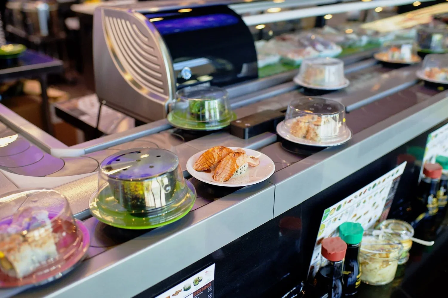Conveyor belt sushi featuring salmon nigiri