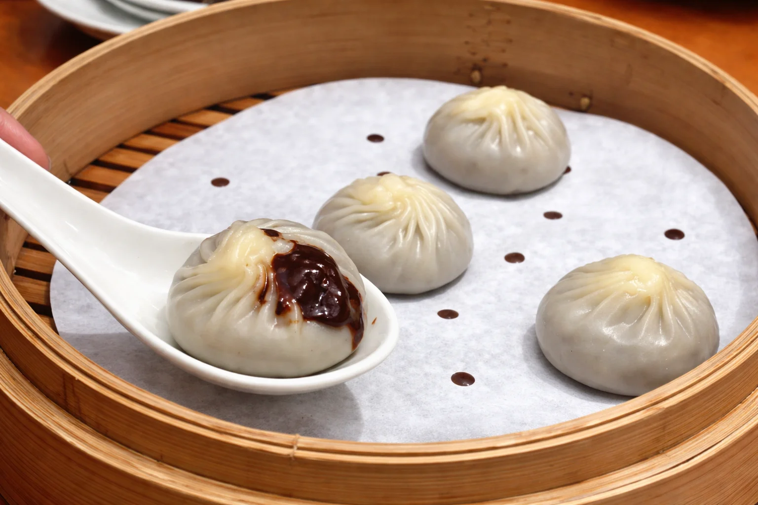 Steamed Chinese soup dumplings in a bamboo basket