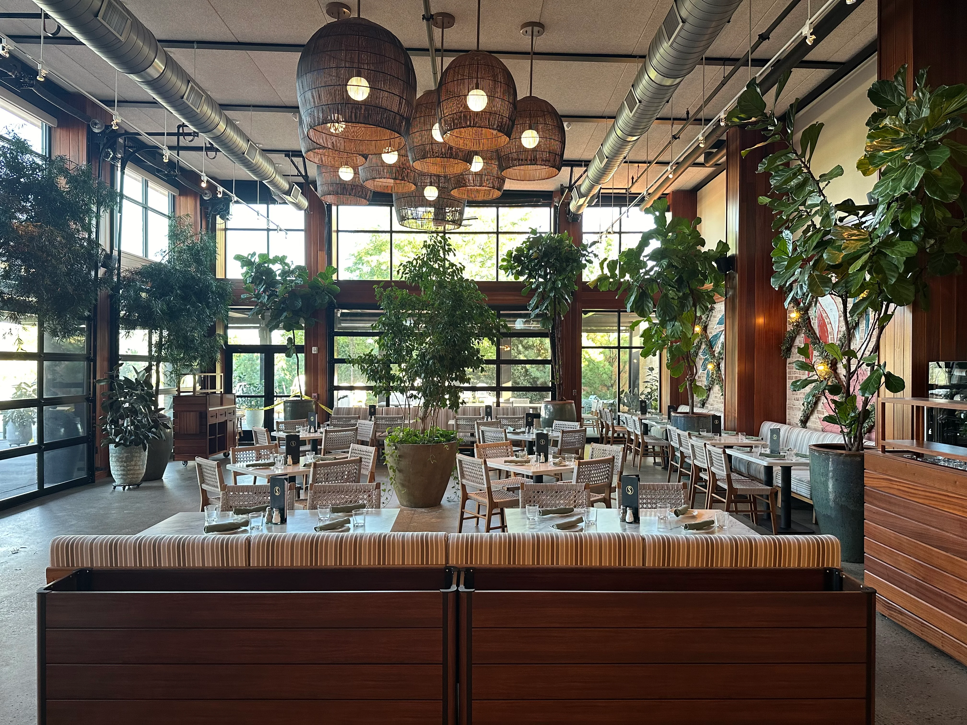 Stylish restaurant interior with greenery and modern decor