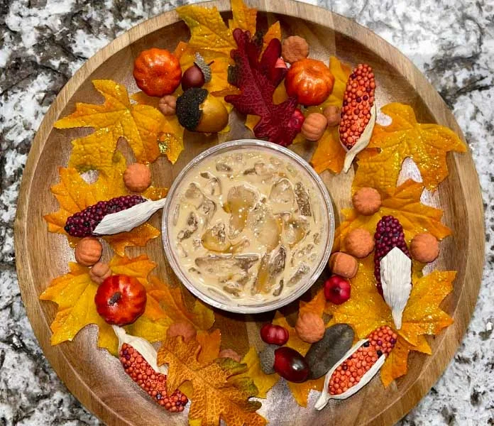 Creamy pumpkin spice dessert in a festive autumn setting