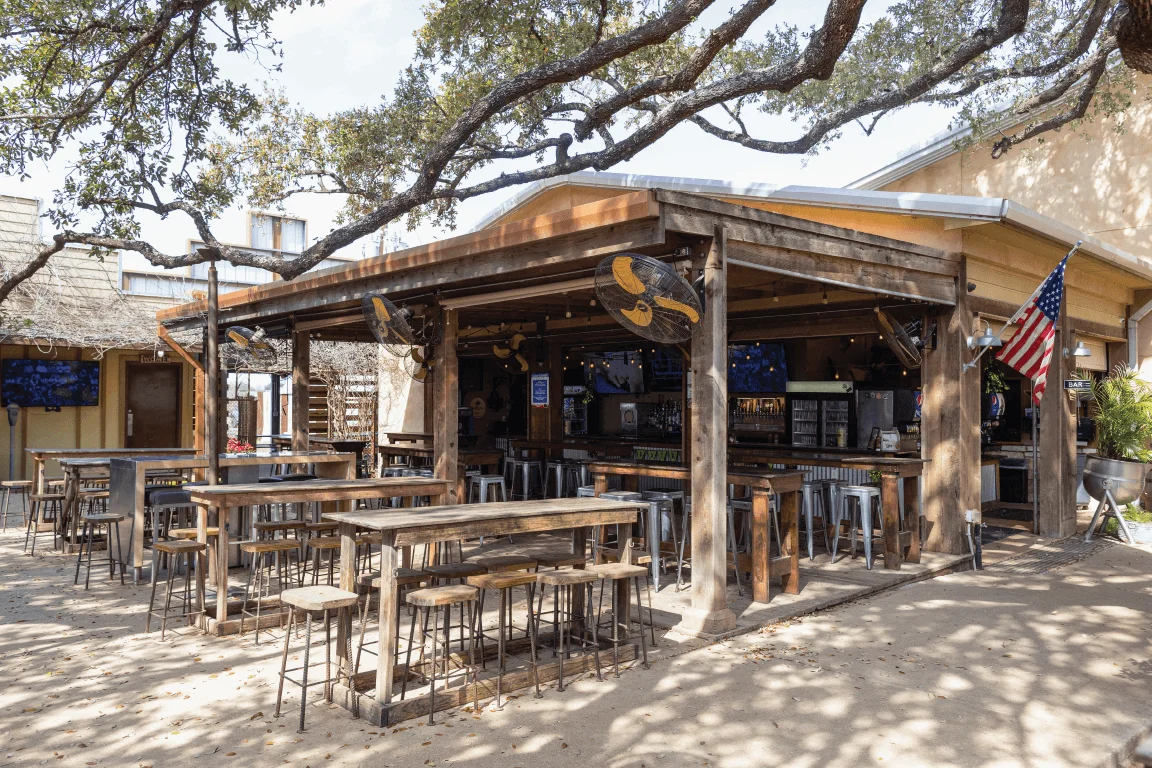 Delicious gourmet burger with fresh toppings on a wooden table