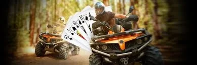 ATV riders in a forest with playing cards