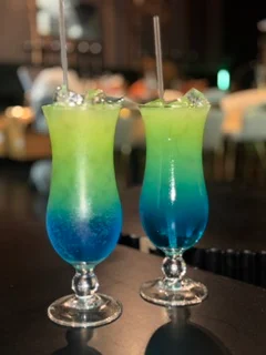 Colorful tropical cocktails with blue and green layers