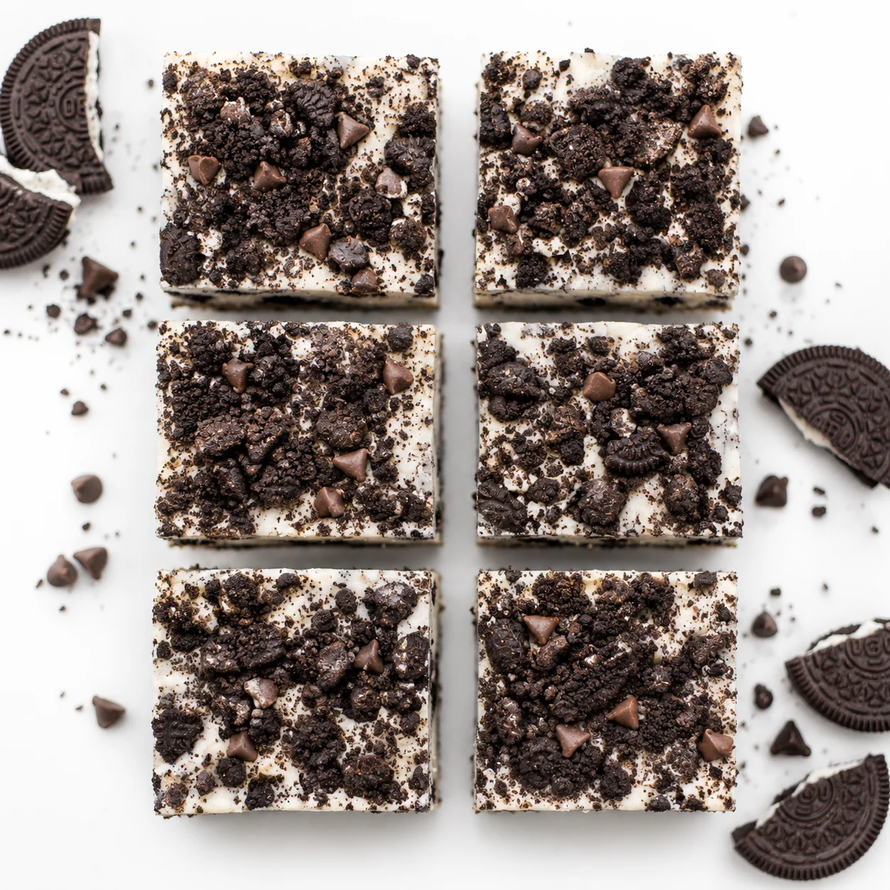 Decadent Oreo cheesecake bars topped with chocolate chips