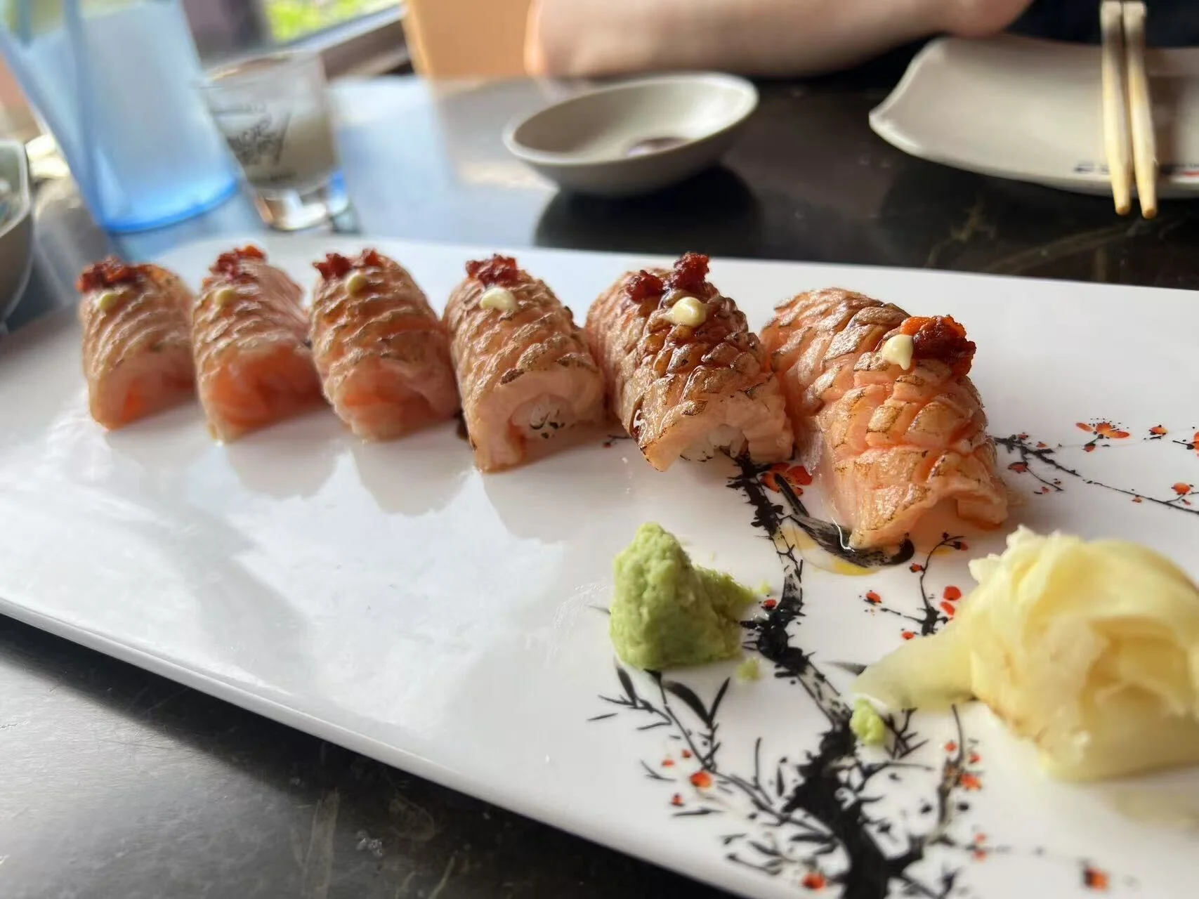 Japanese sushi platter with salmon nigiri and wasabi
