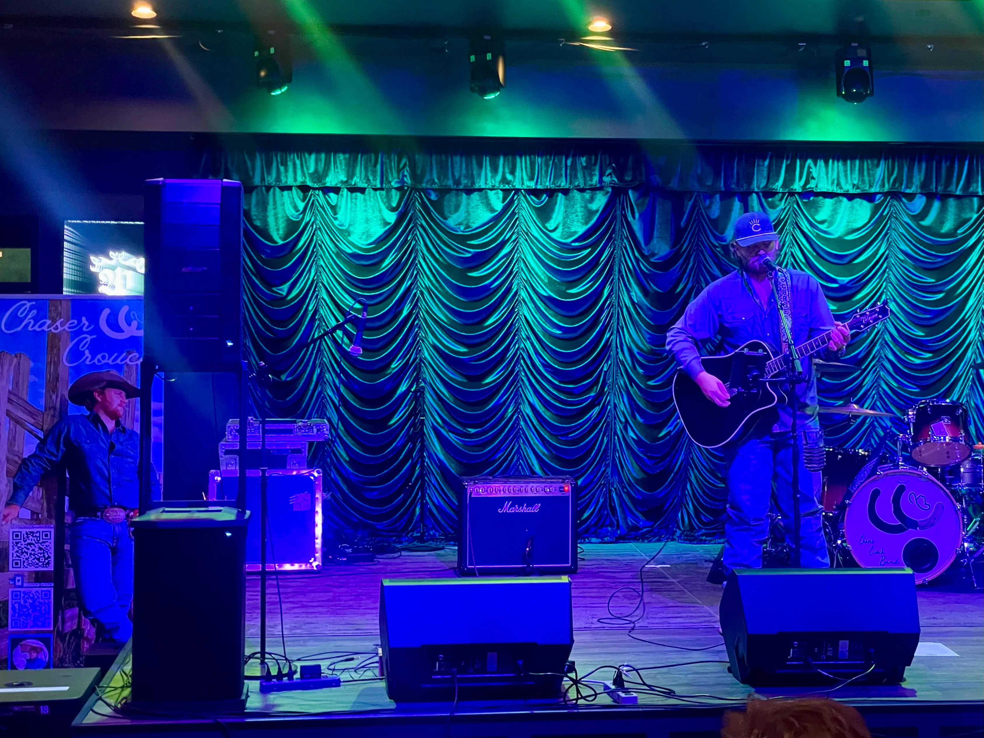 Live music performance at a vibrant venue with stage lights