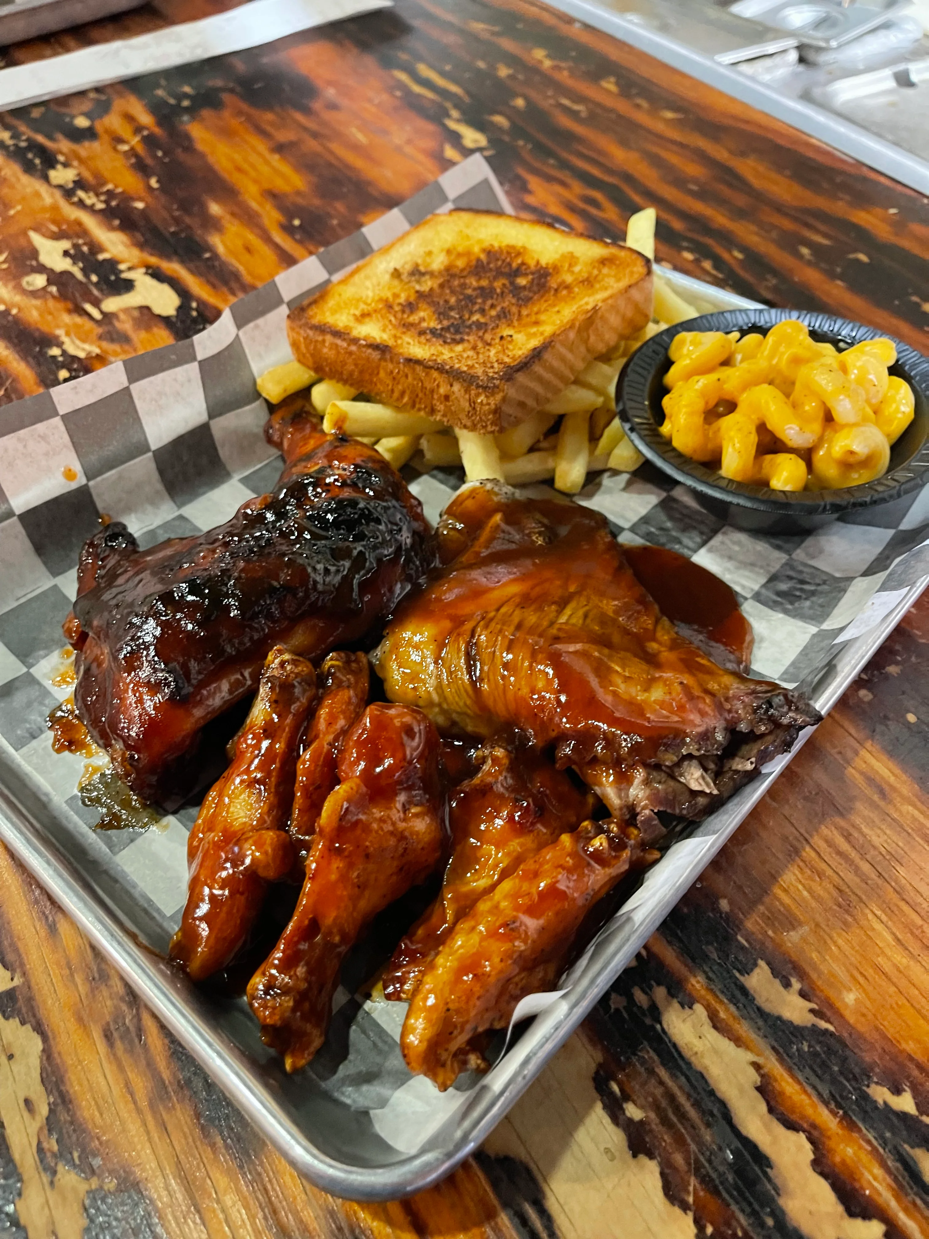 BBQ chicken platter with fries and mac and cheese