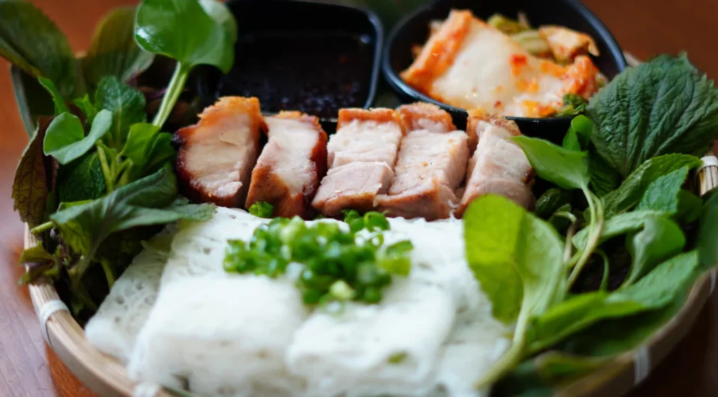 Vietnamese bun thit nuong with grilled pork and fresh herbs