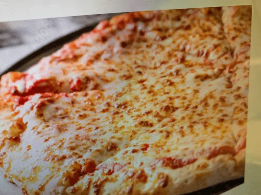 Cheesy Margherita pizza on a black serving tray