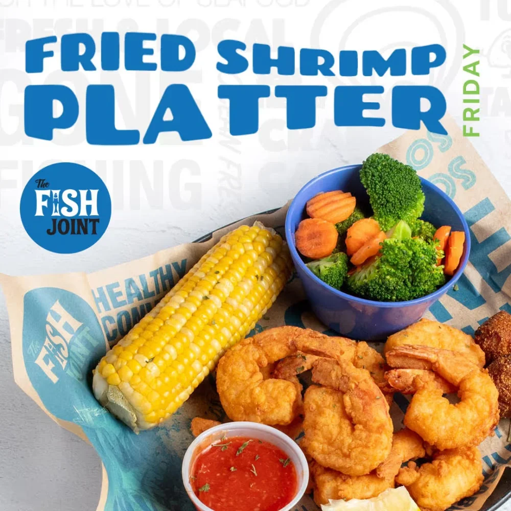 Fried shrimp platter with corn and vegetables