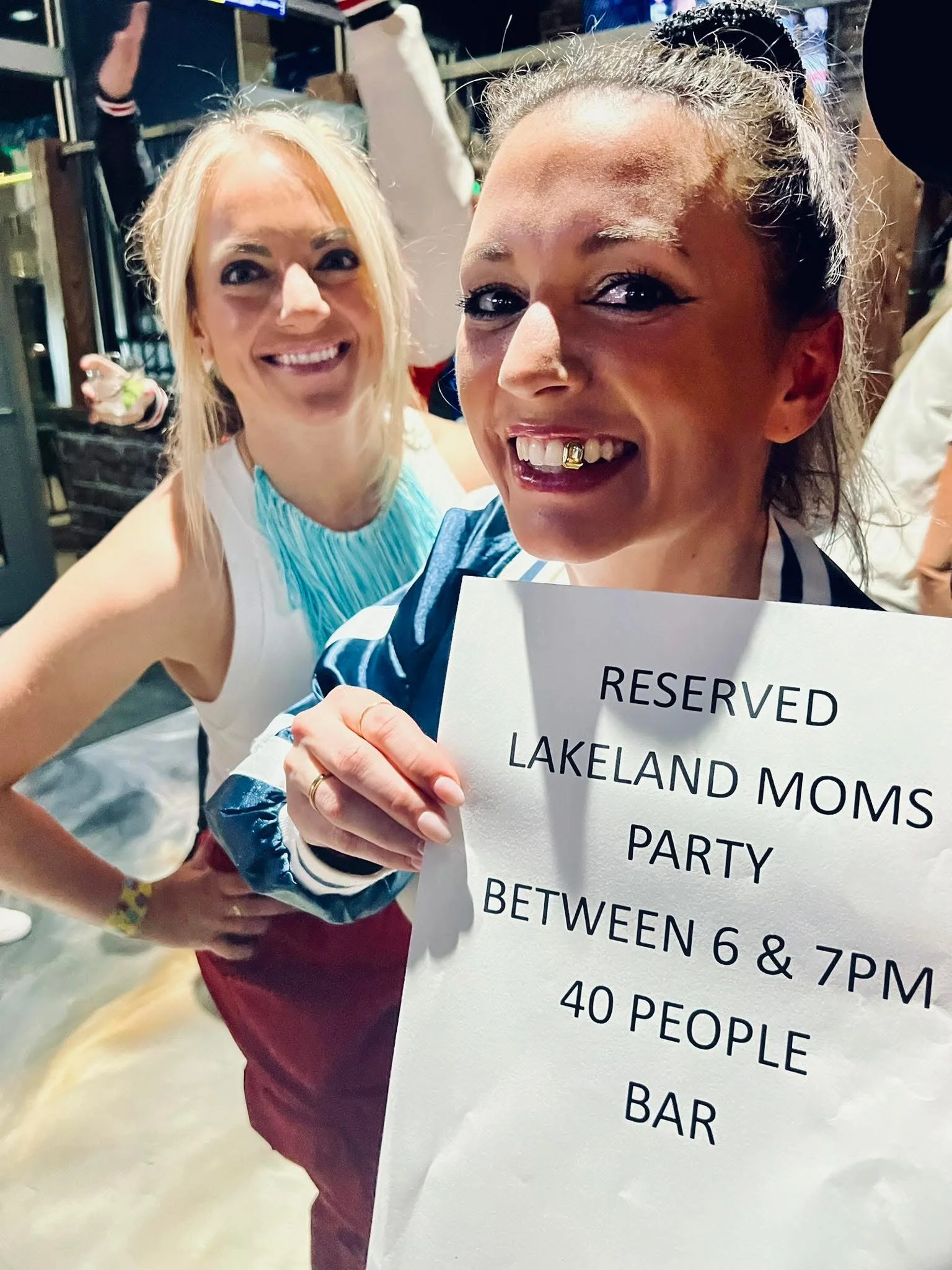 Reserved sign for Lakeland Moms party at a bar