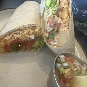 Delicious burrito with rice and fresh vegetables