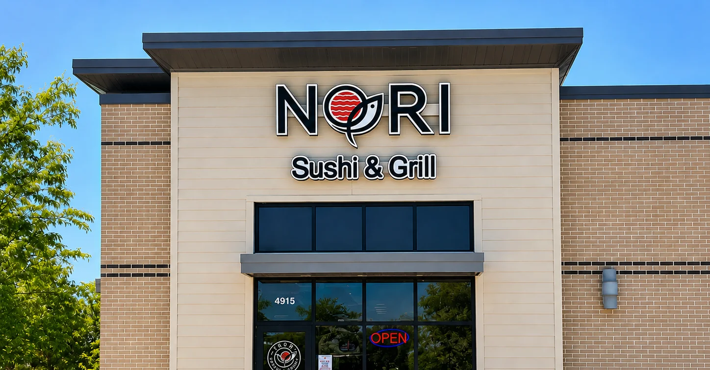 Exterior view of Nori Sushi & Grill restaurant with open sign