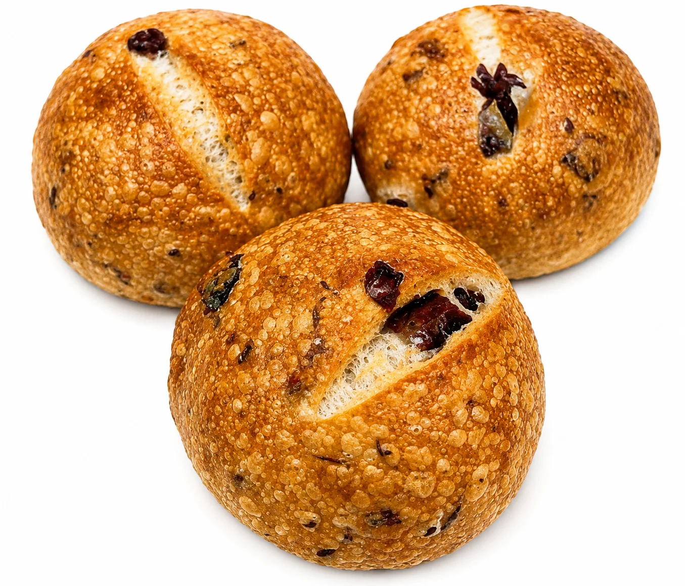 Three round, sesame-coated bread rolls with a split on top.