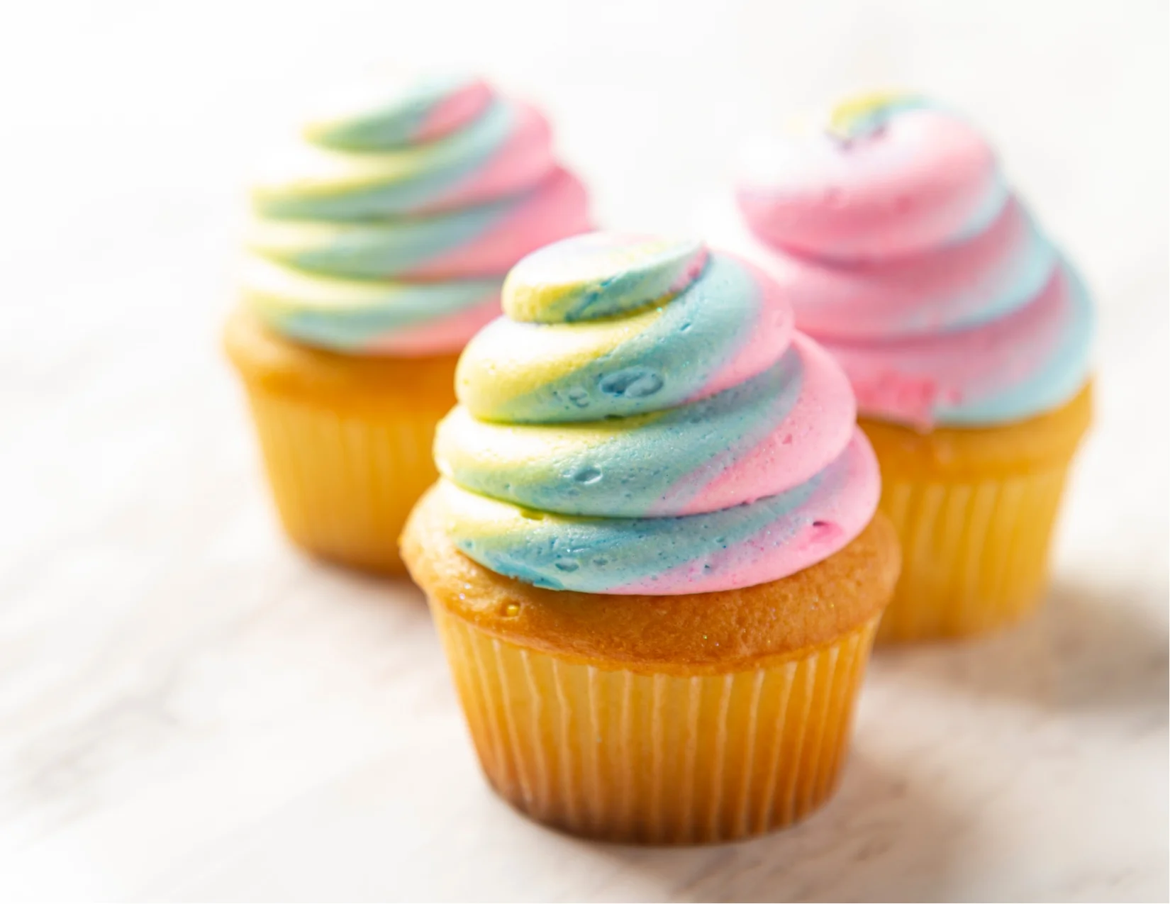Colorful cupcakes with swirled frosting
