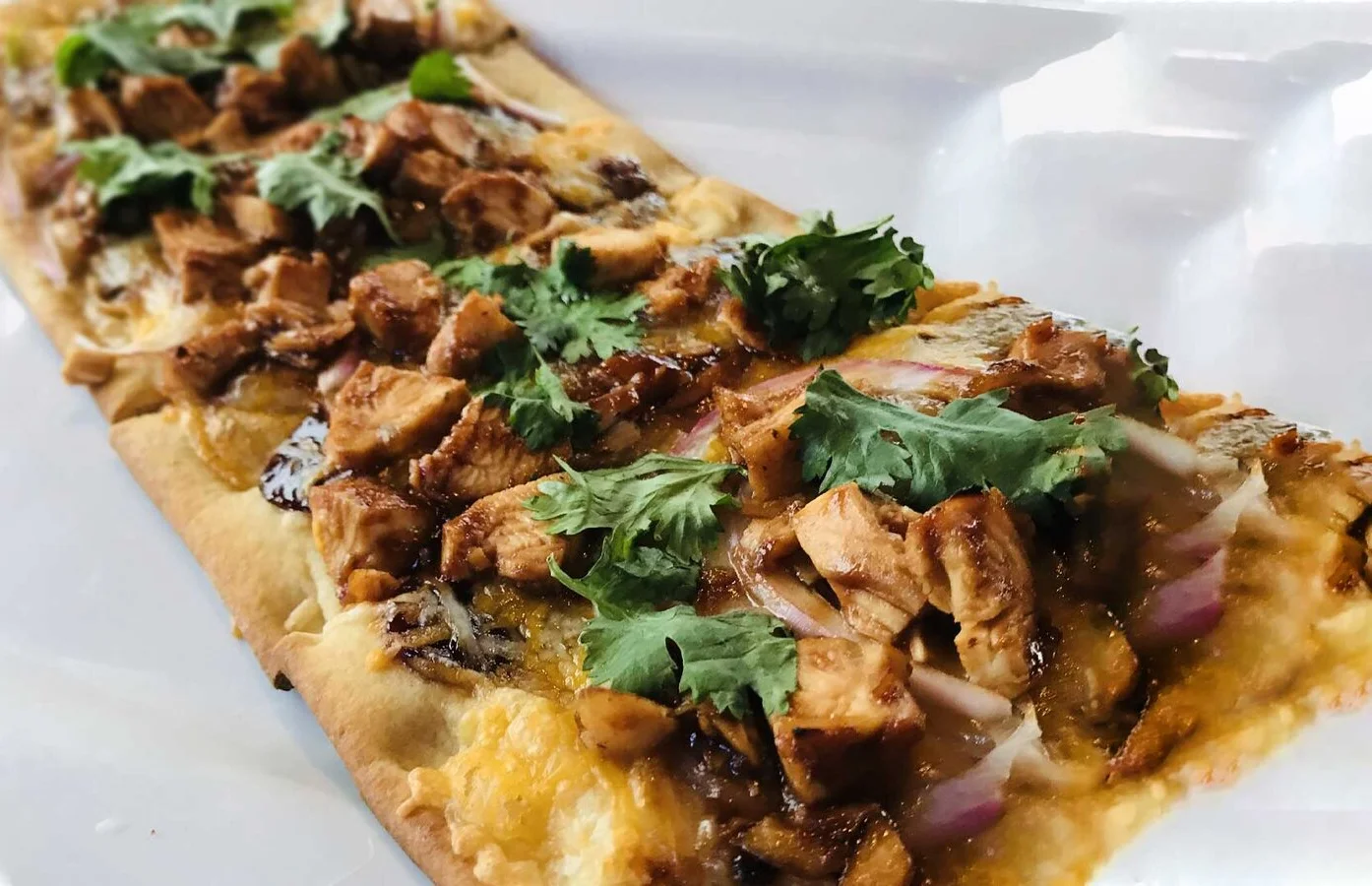 BBQ chicken flatbread with fresh herbs