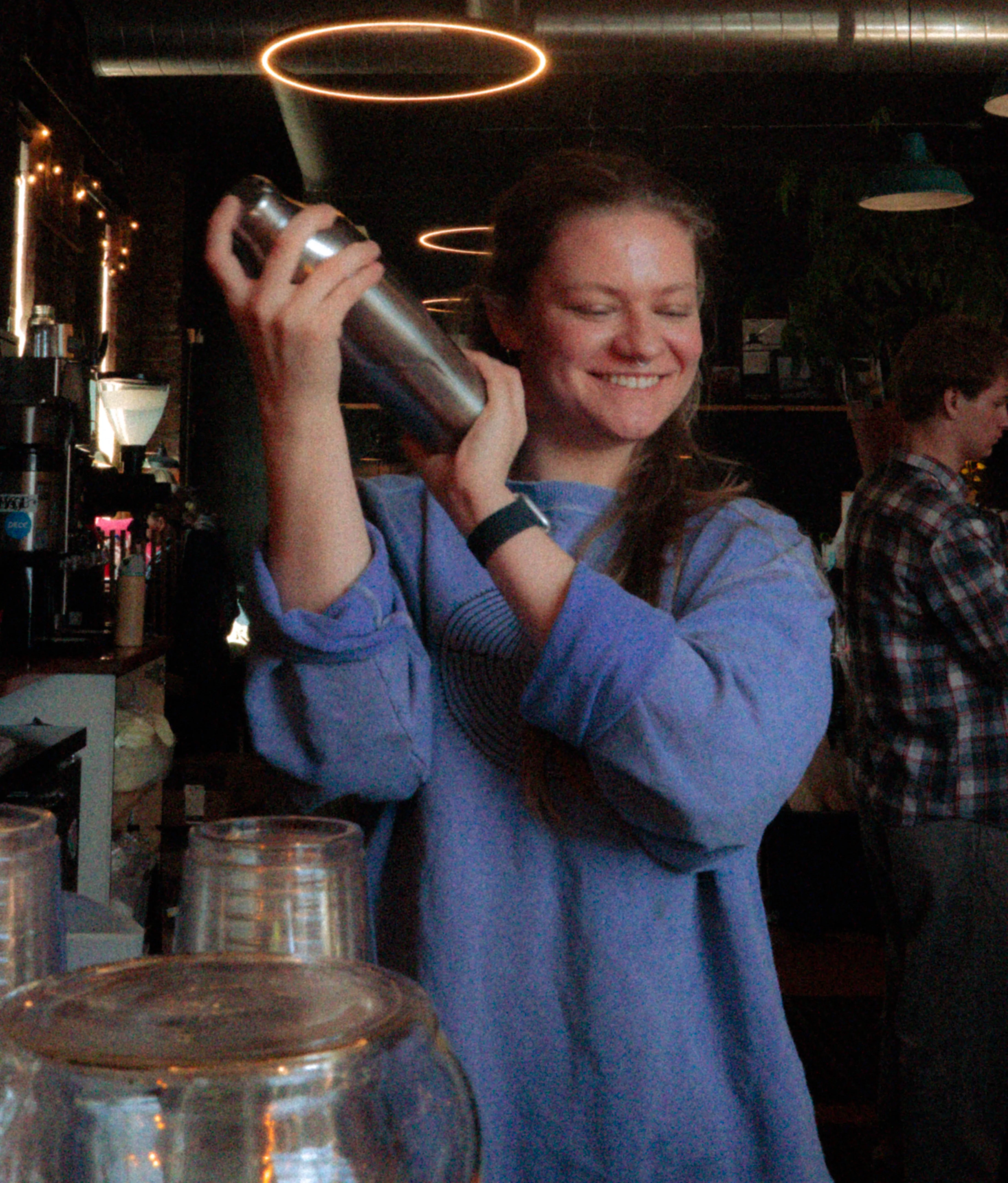 Bartender shaking a cocktail at a trendy bar