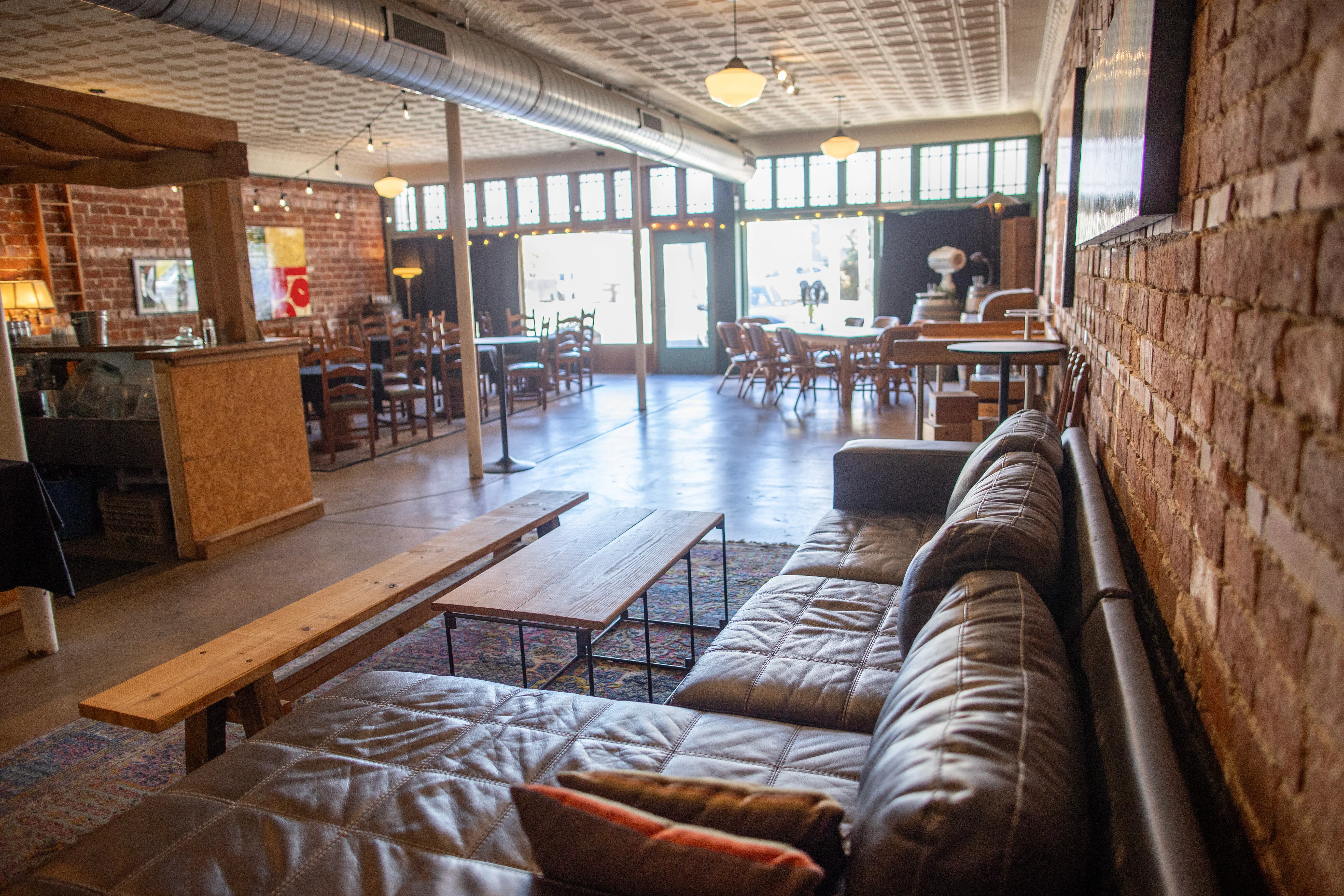 Cozy restaurant interior with leather seating and rustic decor