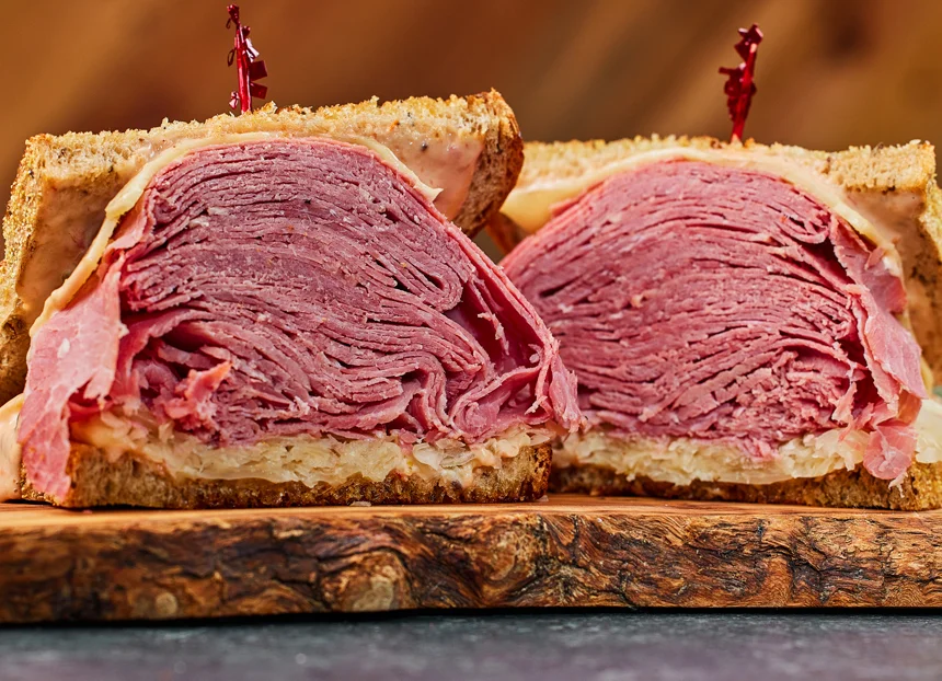 Stacked corned beef sandwich on rye bread