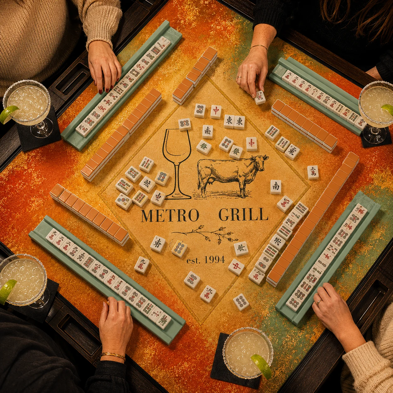 Group playing mahjong at Metro Grill with cocktails