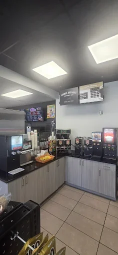 Modern beverage station in a restaurant with coffee and soda dispensers