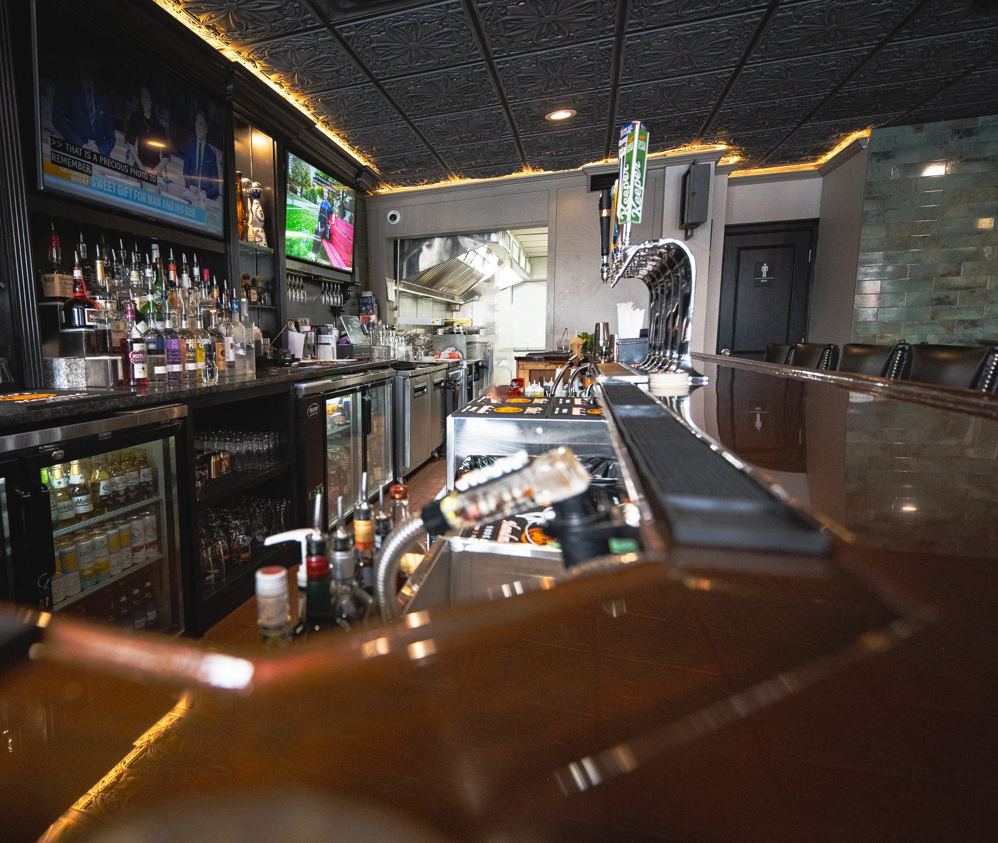 Modern bar interior with sleek design and well-stocked shelves