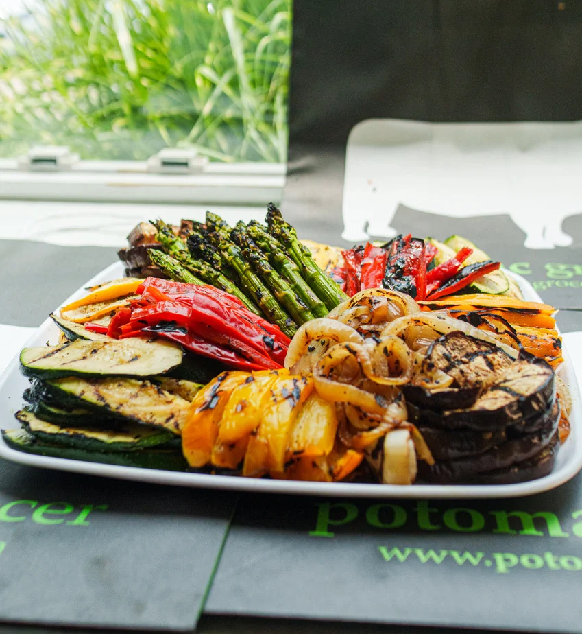 Grilled Mediterranean vegetable platter with vibrant colors and charred textures