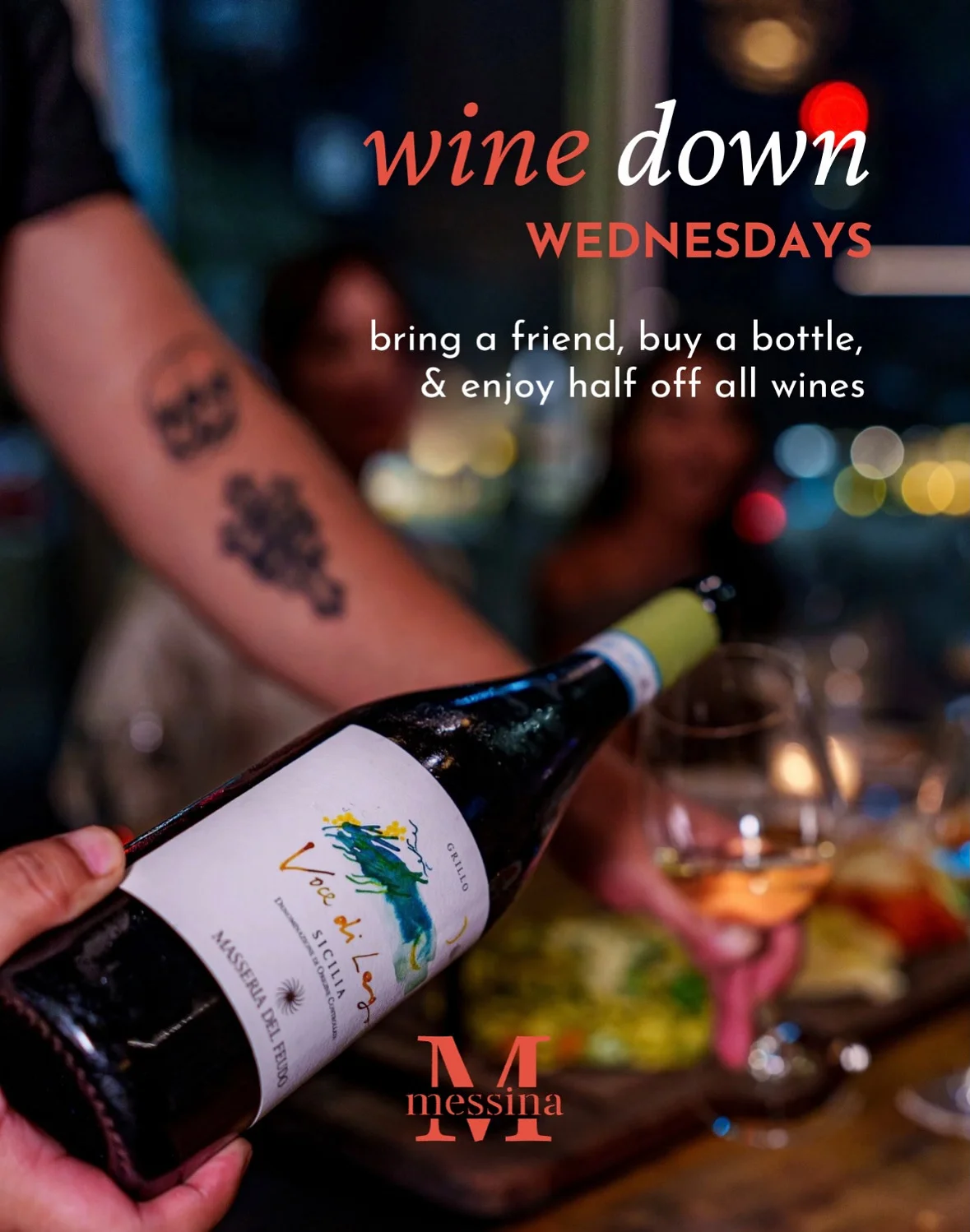 Wine bottle being poured at a cozy restaurant during Wine Down Wednesdays