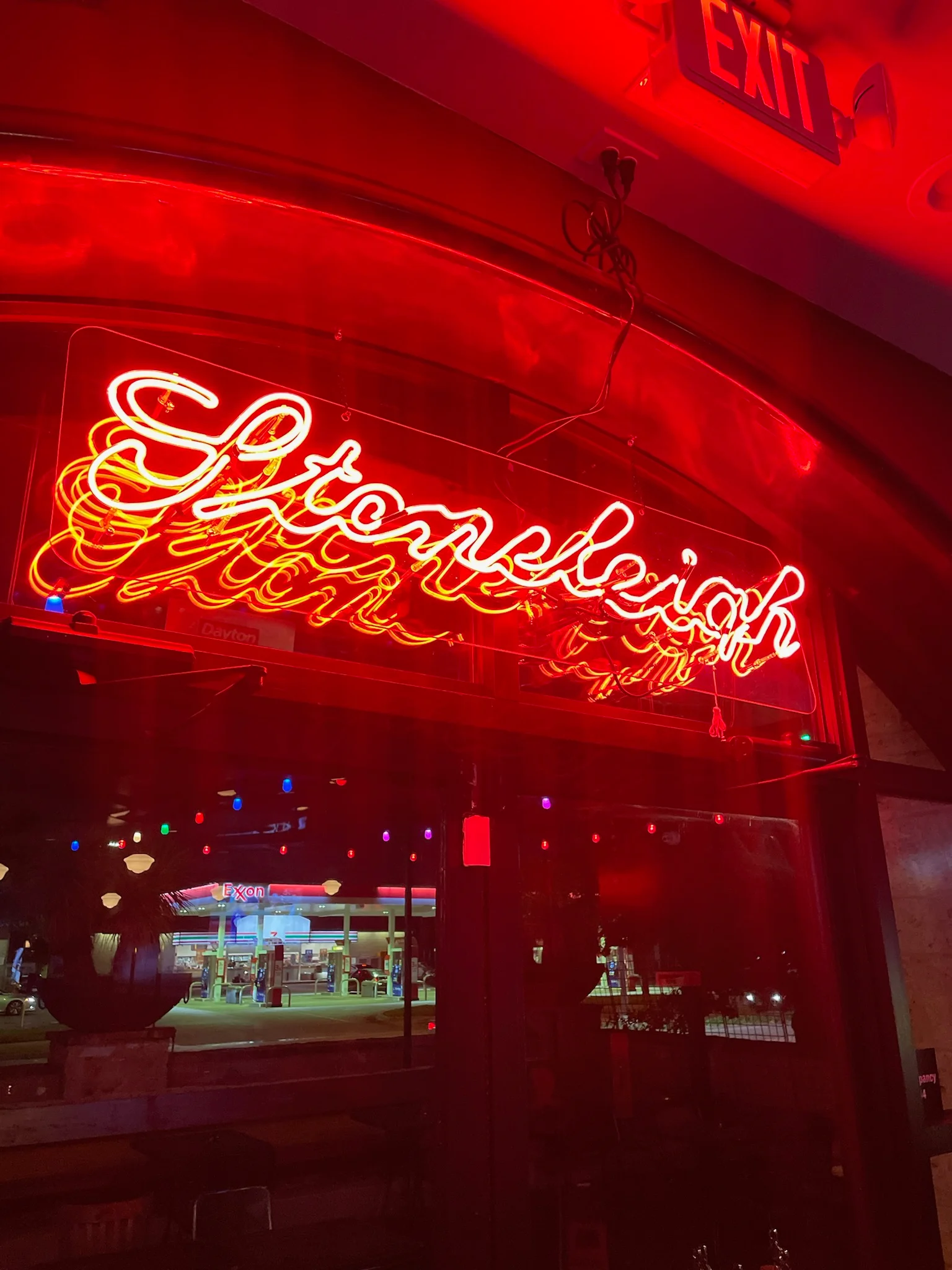 Neon sign of a restaurant with warm lighting