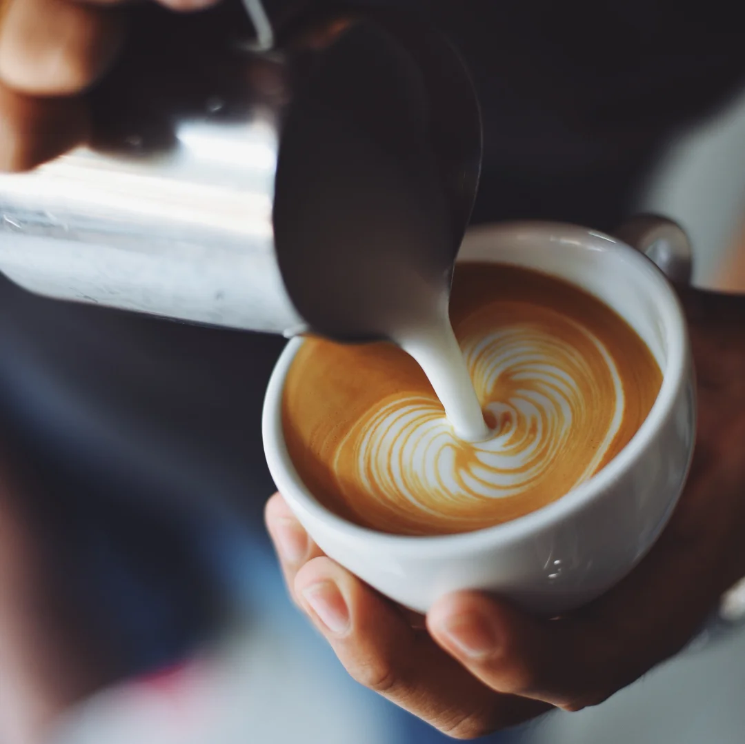 Barista creating latte art