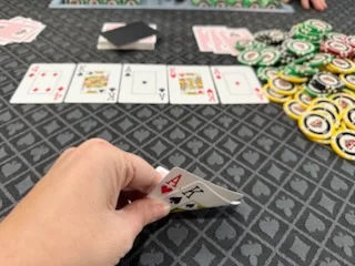Poker hand with two aces and chips on a gaming table