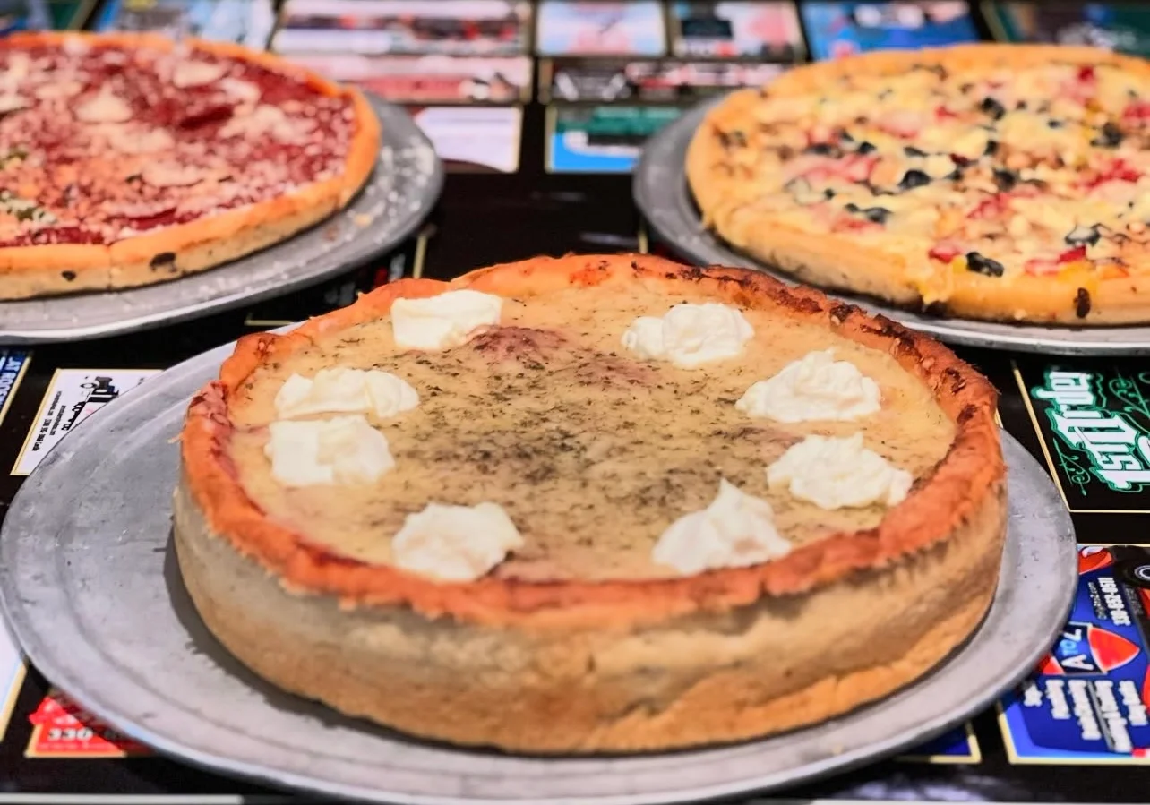 Delicious Chicago-style deep dish pizza with creamy topping