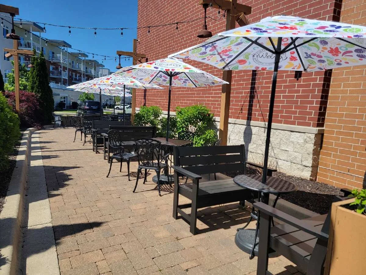 Outdoor dining area with colorful umbrellas and seating