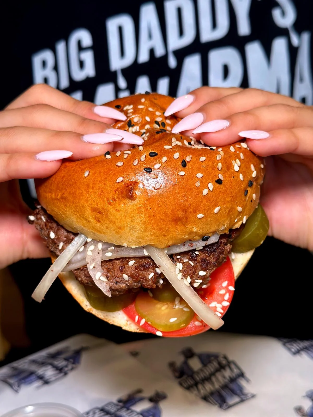 Juicy American cheeseburger with sesame bun