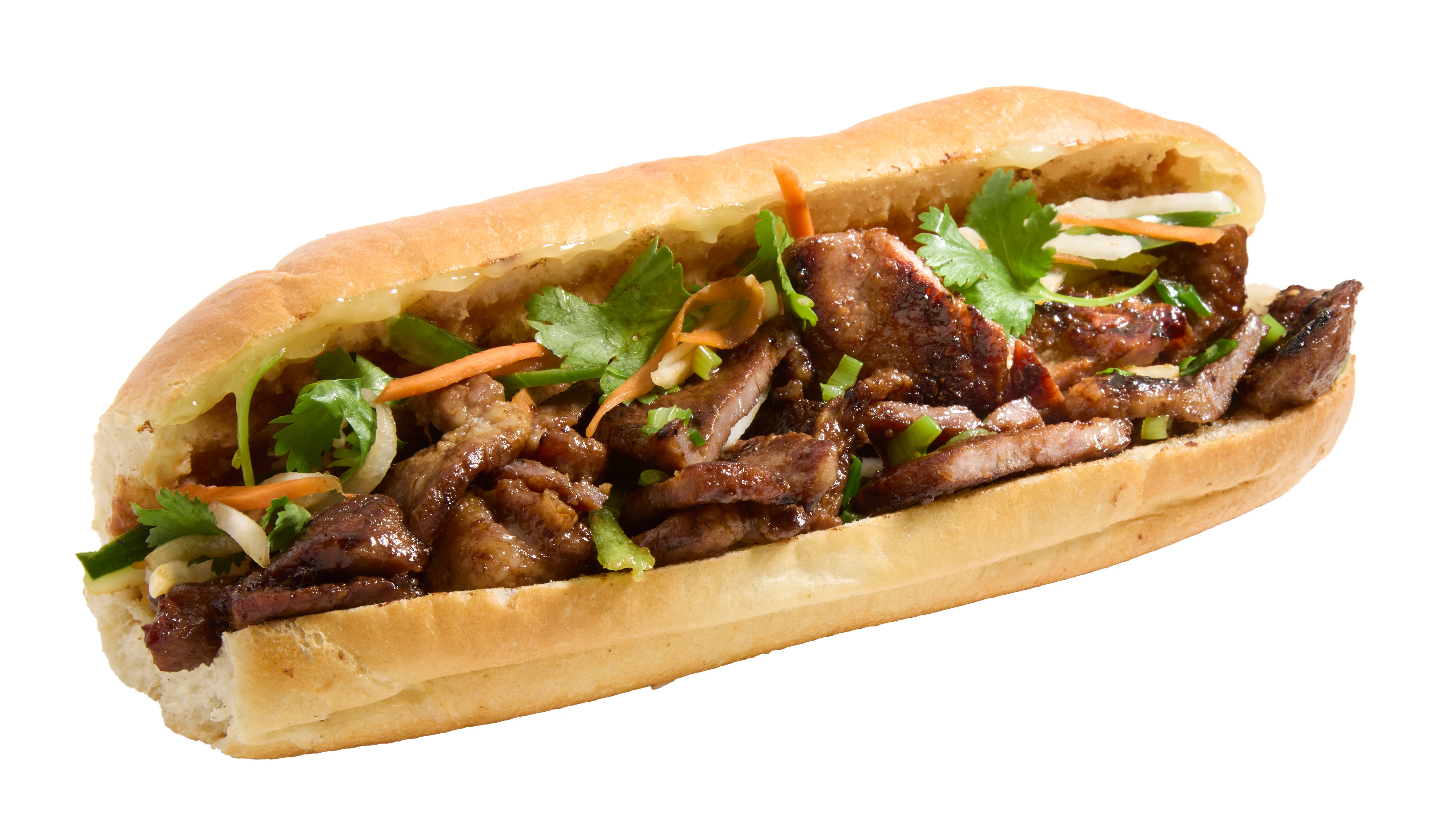 Grilled pork dish served with vegetables and garnishes