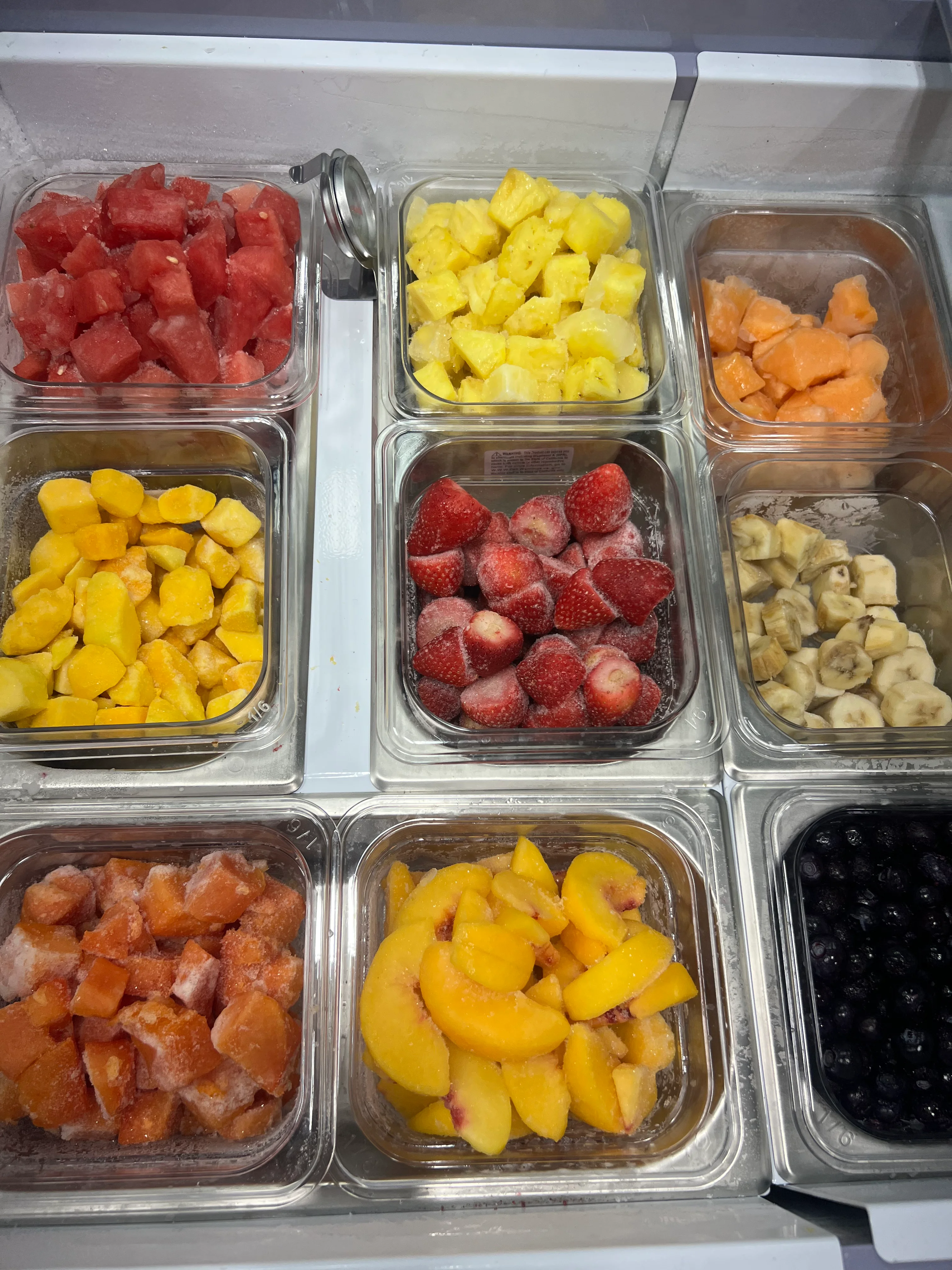 Colorful assortment of frozen fruits for smoothies and desserts