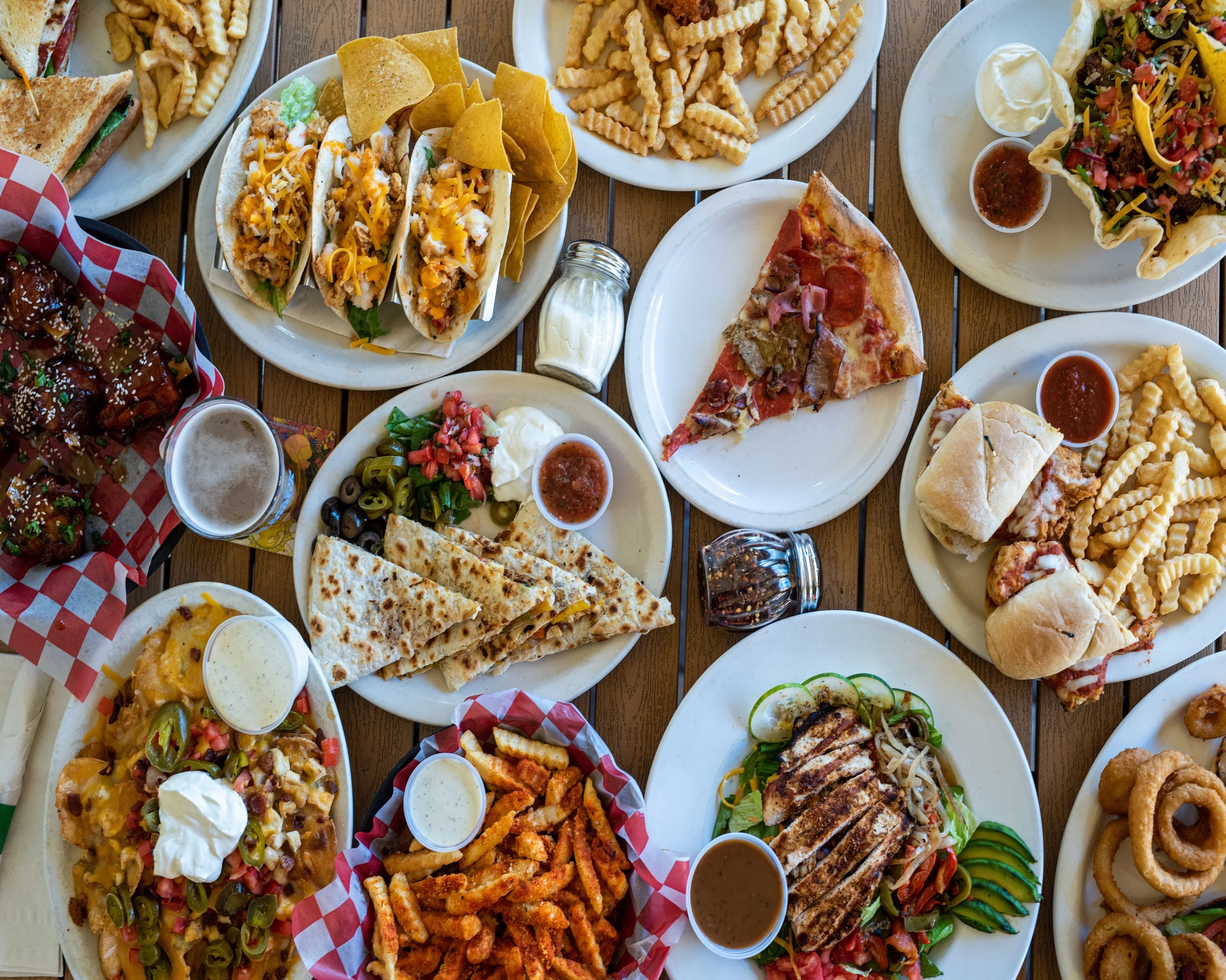 Variety of American comfort food including tacos, pizza, and nachos
