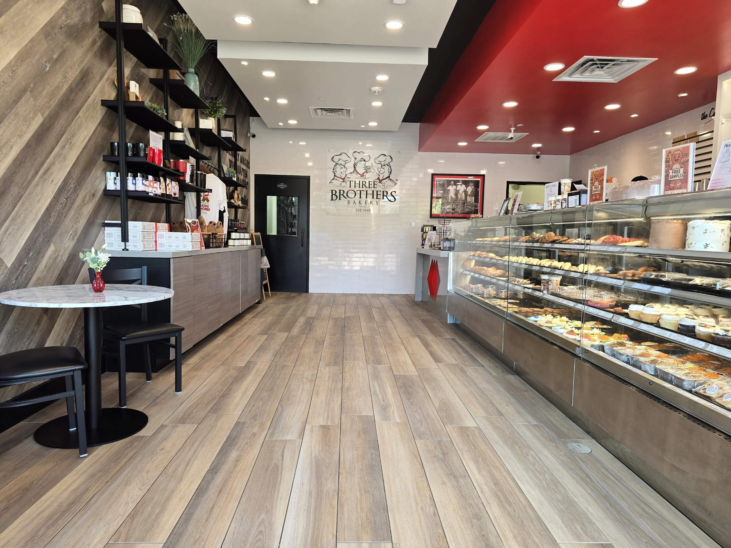 Modern bakery interior with display case and seating area