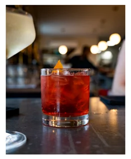 Classic Negroni cocktail garnished with an orange twist