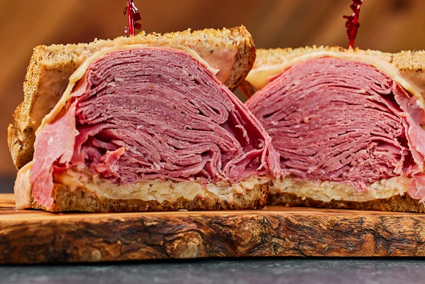 Stacked corned beef sandwich on rye bread
