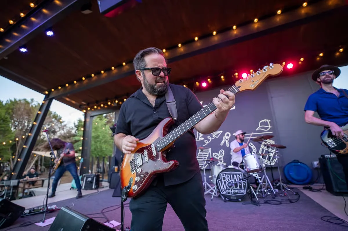 Live band performing on stage with vibrant lighting