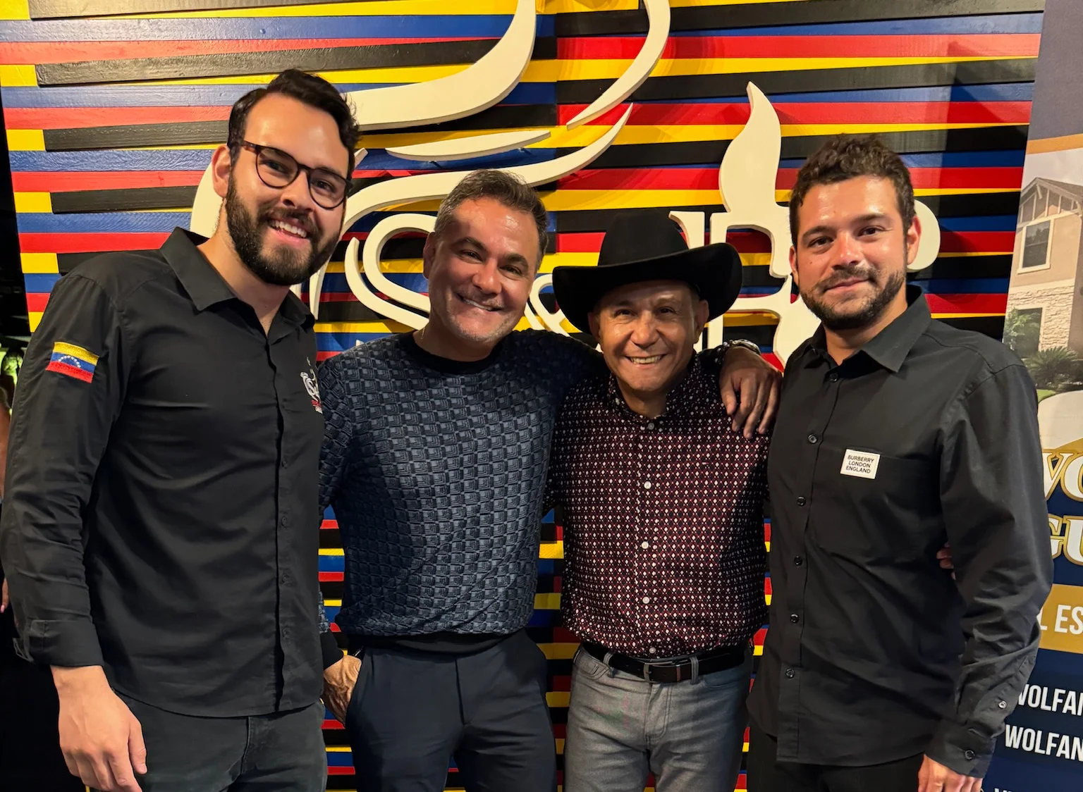 Group of restaurant staff posing in a vibrant dining area