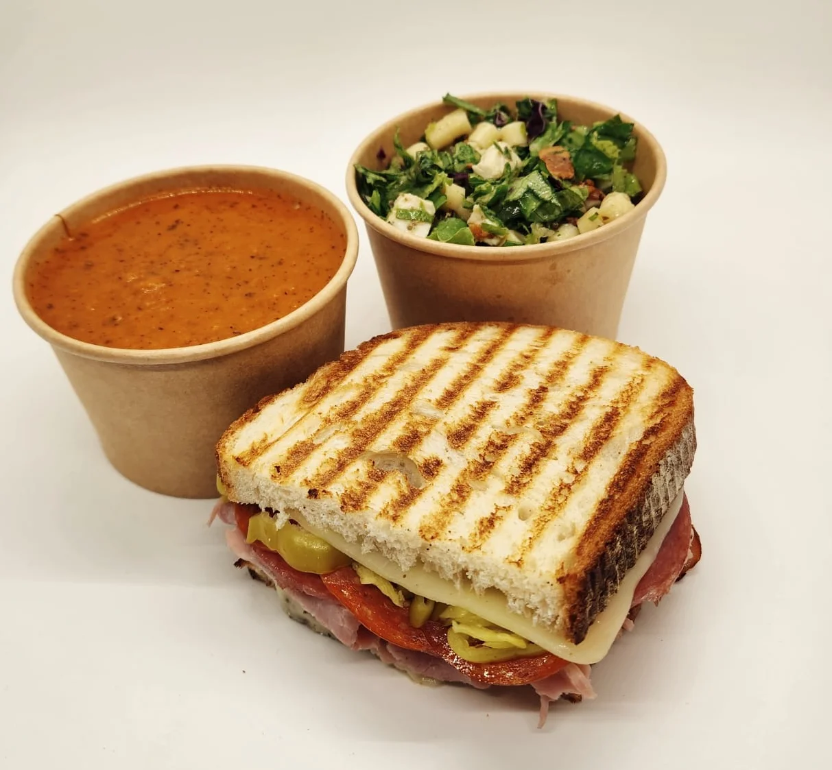 Grilled sandwich with soup and salad, a classic lunch combo