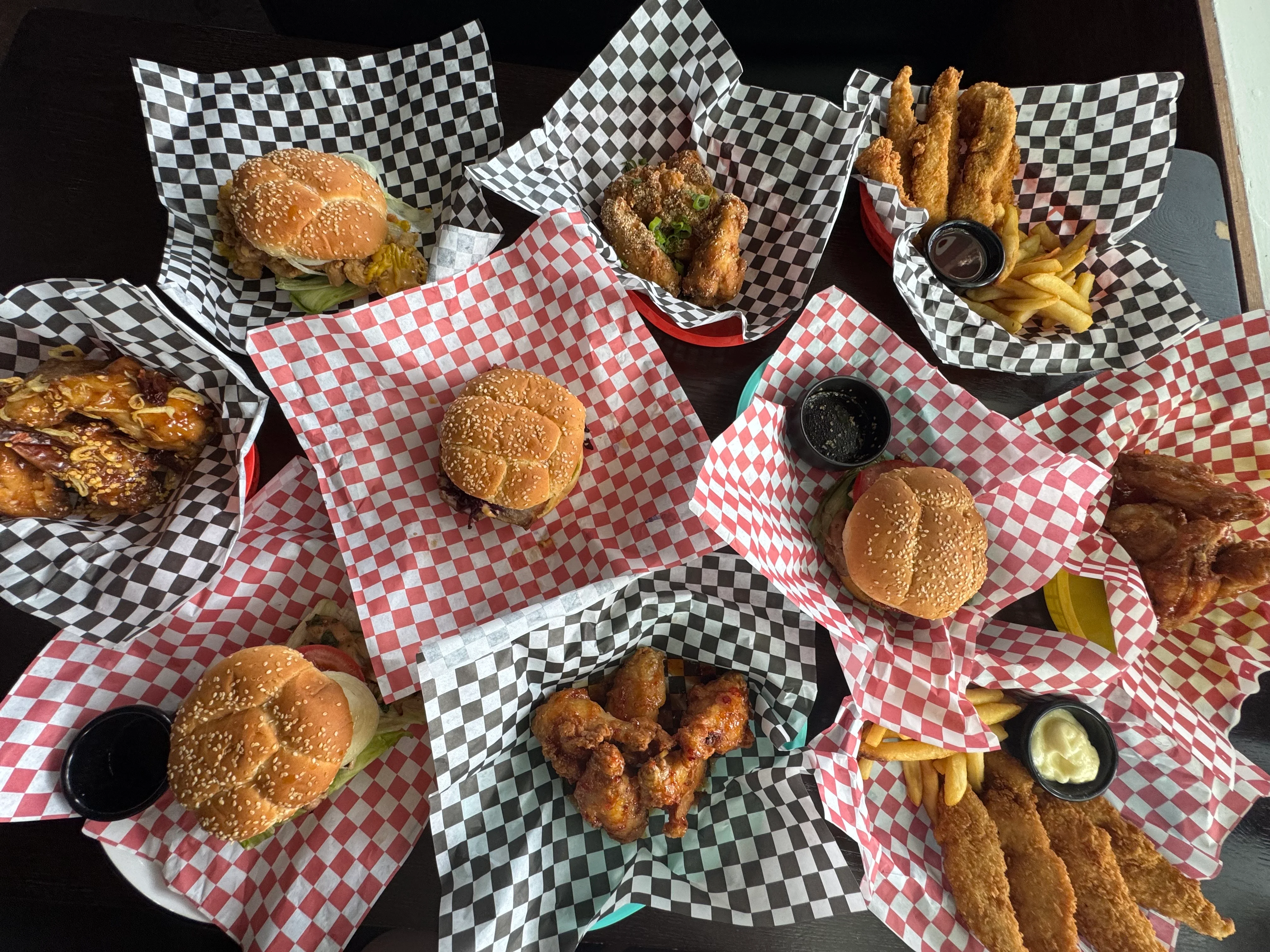 Assorted American comfort food with burgers and wings