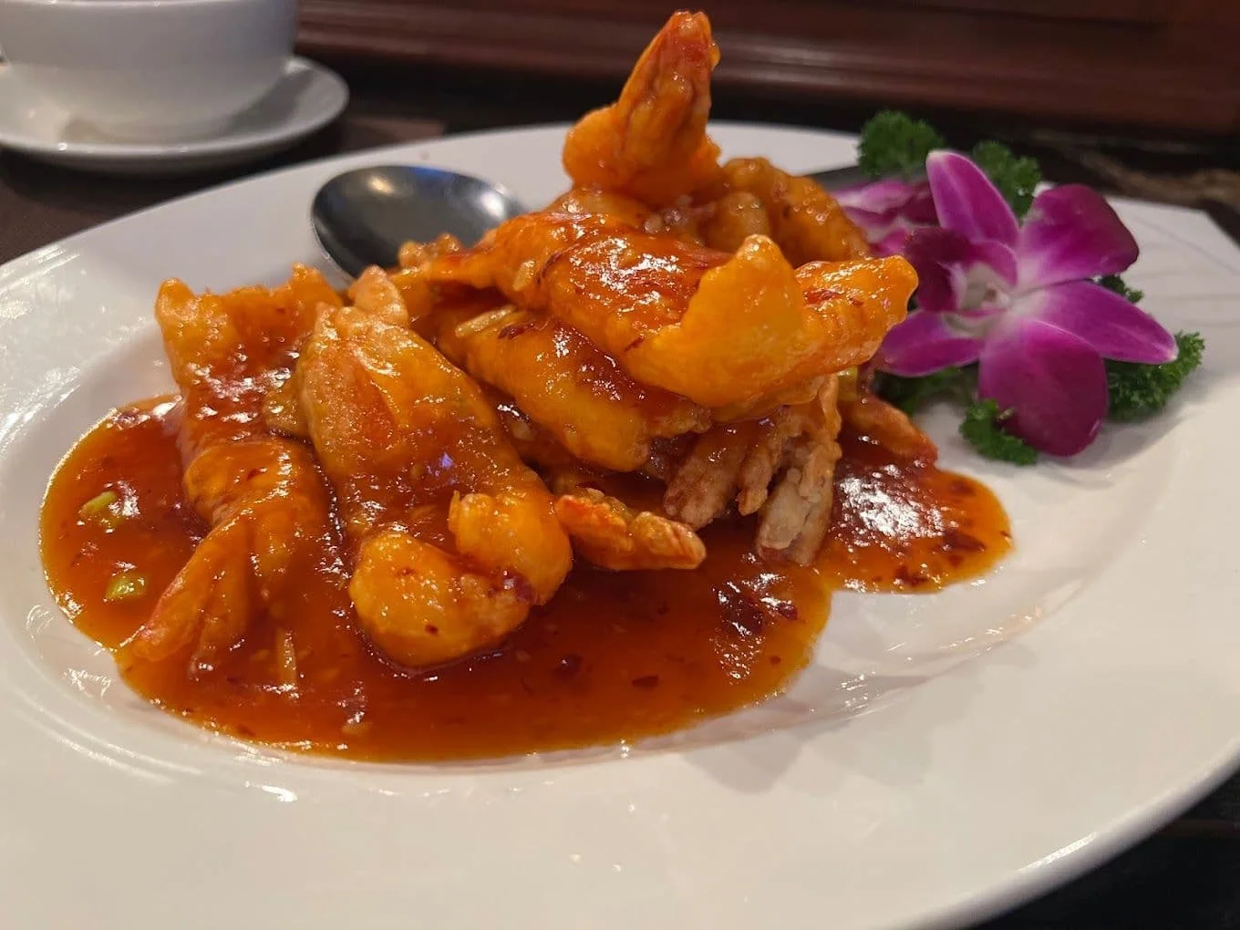Sweet and sour shrimp dish served with vibrant sauce