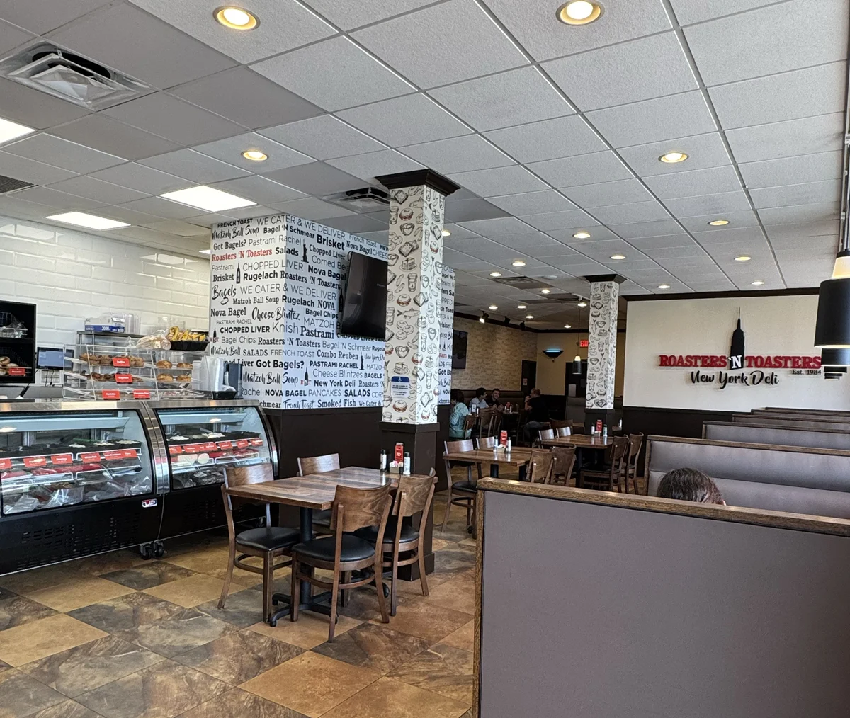 Dining room and deli counter inside Roasters ’N Toasters Aventura