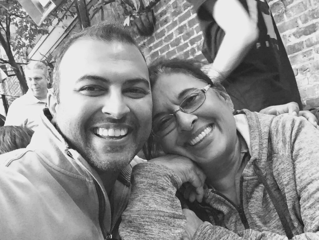 A mother and son, smiling together outside of Tiffin Box